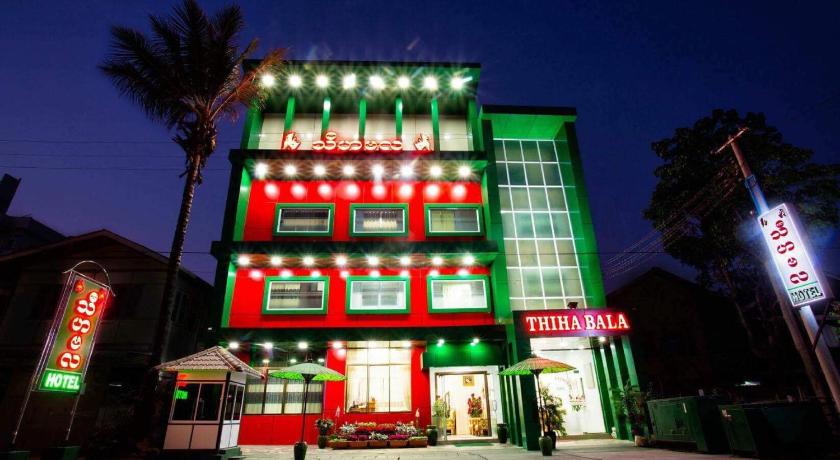 a large building with a clock on the side of it, Thiha Bala Hotel in Pyin Oo Lwin