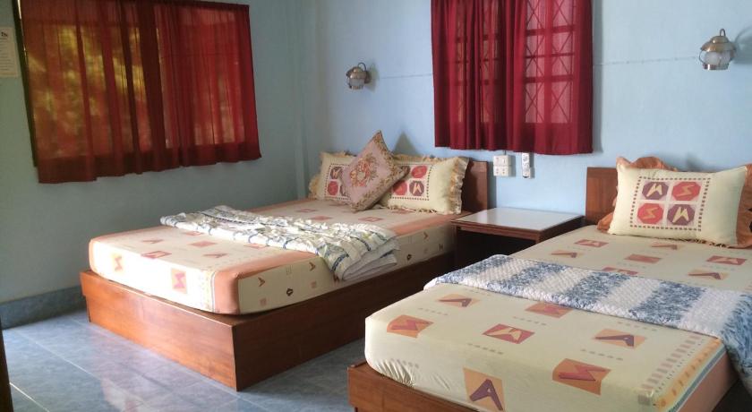 a hotel room with two beds and two lamps, Light In bungalow in Ko Pangan