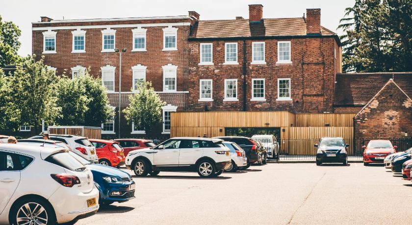 cars parked in front of a brick building, Birchover Bridgford Hall in Nottingham
