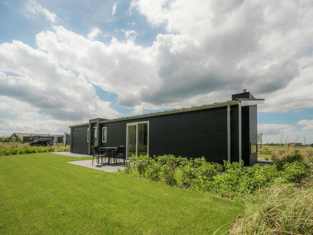 Modern chalet at the edge of a forest near the Oosterschelde photo 1