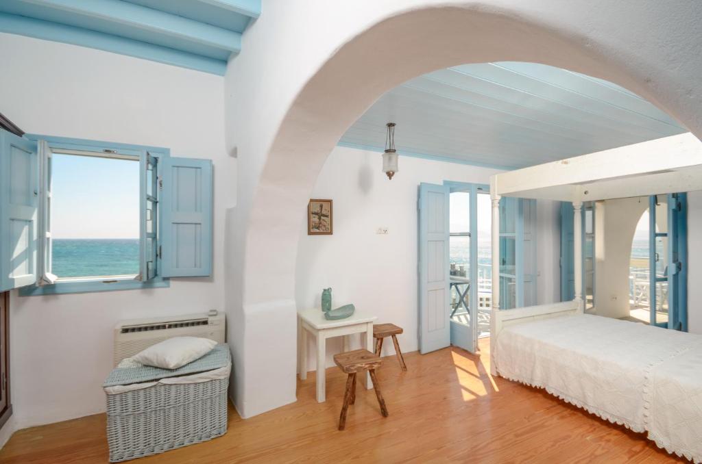 Unique Beachfront Cycladic Villa @ Agios Prokopios - Tap to explore photos