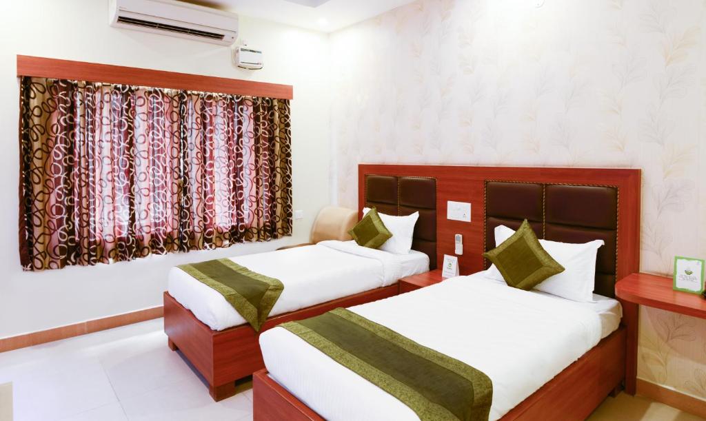 Двухместный ([Sanitized] Deluxe Twin Room), Treebo Sekaran