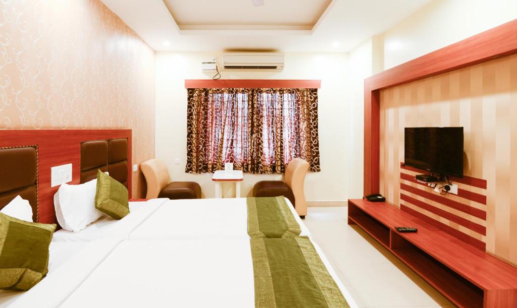 Двухместный ([Sanitized] Deluxe Twin Room), Treebo Sekaran