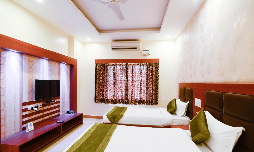 Двухместный ([Sanitized] Deluxe Twin Room), Treebo Sekaran