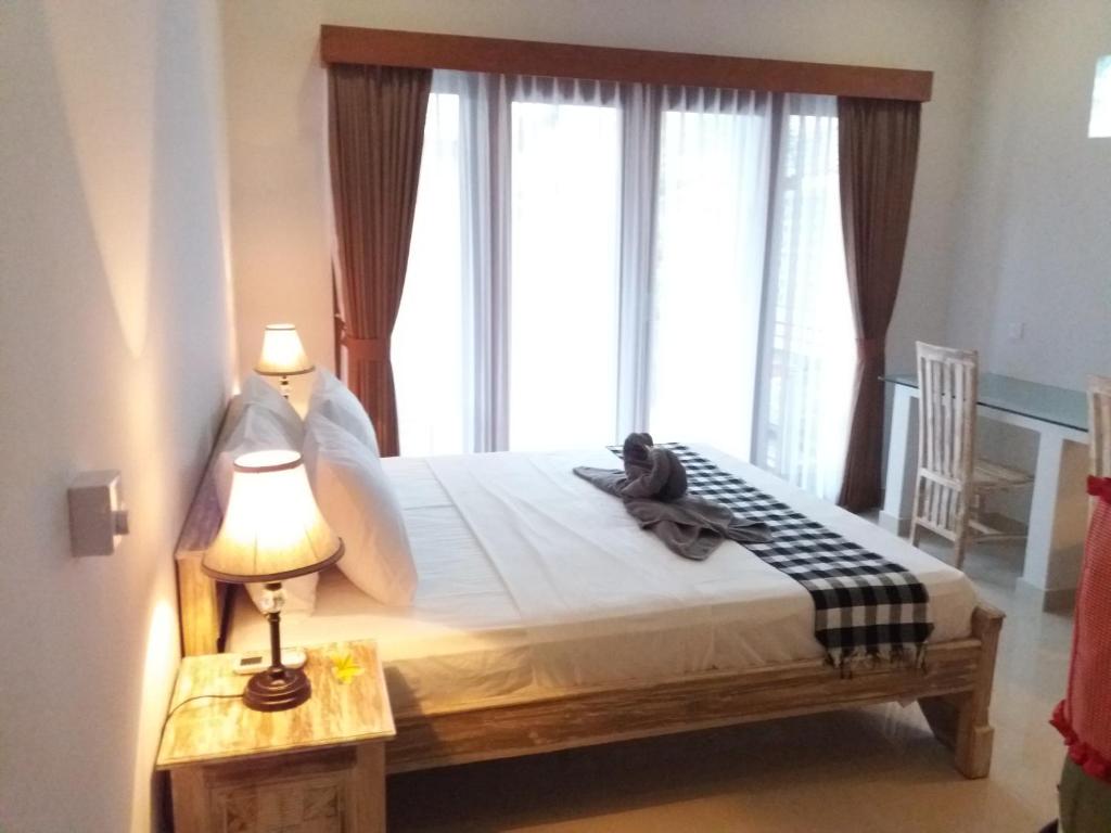 Двухместный (Двухместный номер Делюкс с 1 кроватью и балконом), Candra Surf Homestay