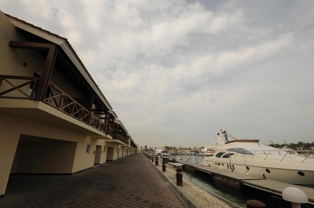 Al Bander Hotel & Resort - Tap to explore photos