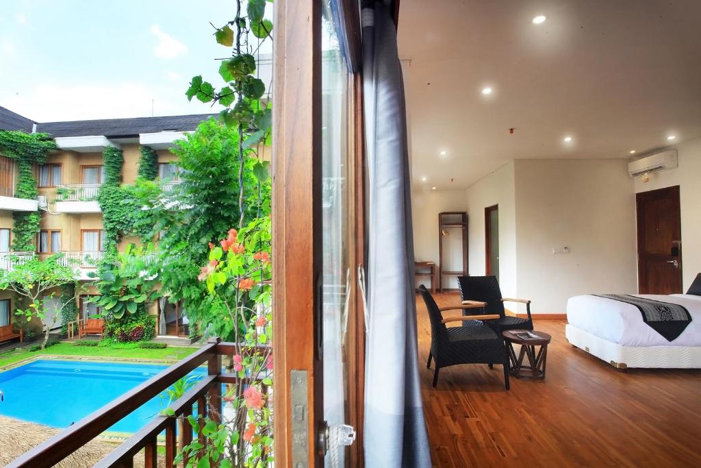 Семейный (Семейные апартаменты с балконом и видом на бассейн), Hotel Puriartha Ubud