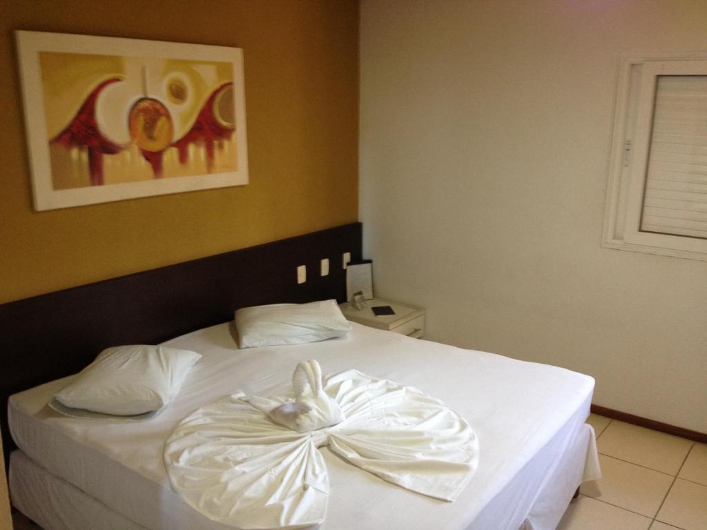 Saint Patrick Praia Hotel - Tap to explore photos