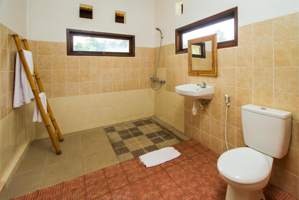 Двухместный (Двухместный номер Делюкс с 1 кроватью и балконом), Manggis Sari Guesthouse