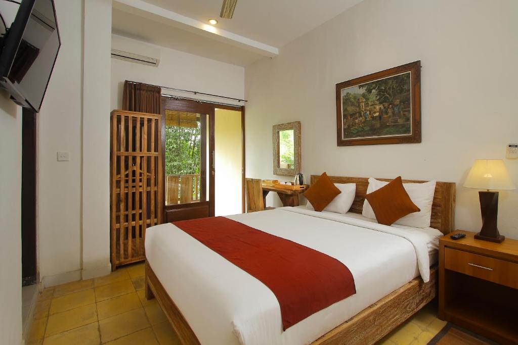 Двухместный (Двухместный номер Делюкс с 1 кроватью и балконом), Manggis Sari Guesthouse