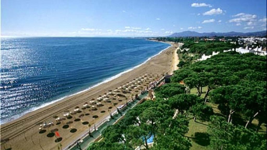White Pearl Beach - Elviria Playa - Tap to explore photos