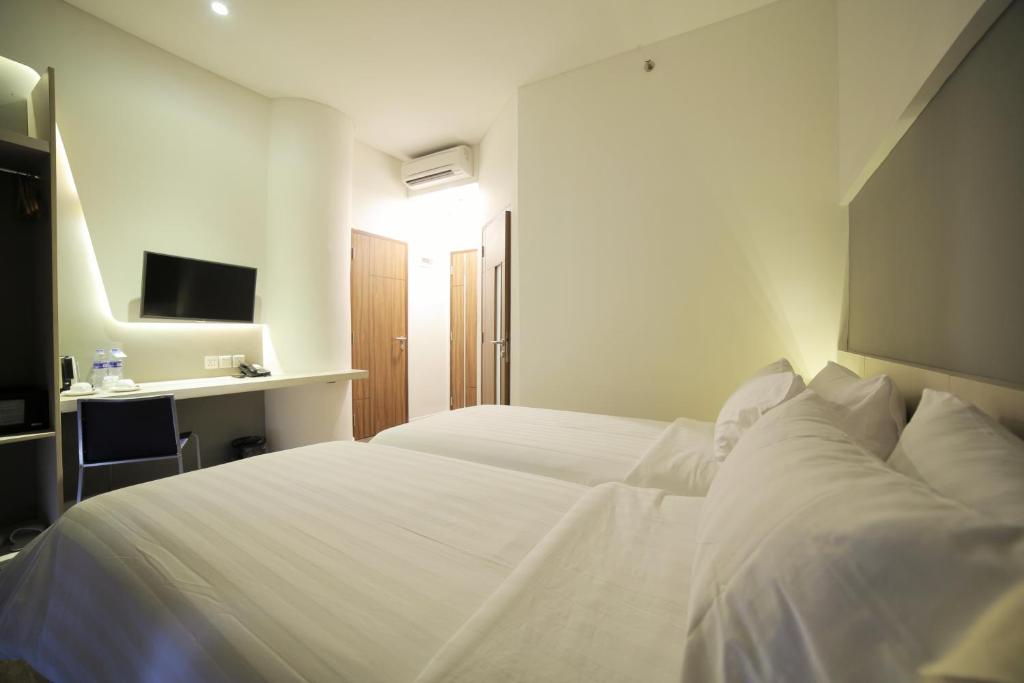 Двухместный (Двухместный номер Делюкс с 2 отдельными кроватями), Ozone Hotel Pantai Indah Kapuk