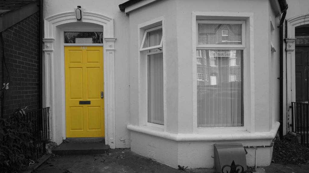 Big Yellow Door in Queens Quarter - Tap to explore photos