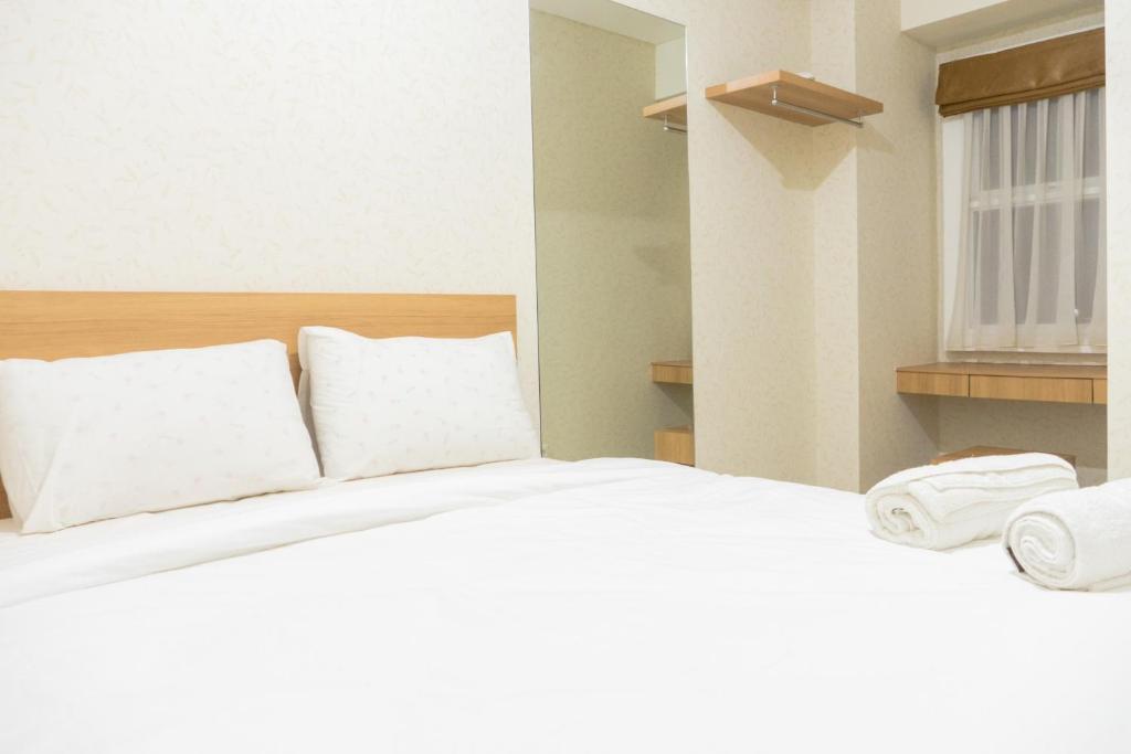 Minimalist 2BR Apartment at Parahyangan Residence By Travelio