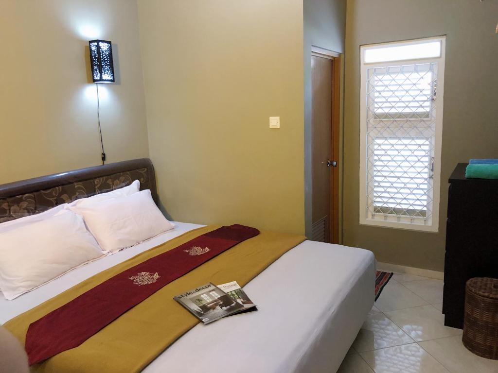 Argya Guesthouse Room Type - Deluxe Double Room (2 Adults + 1 Child)