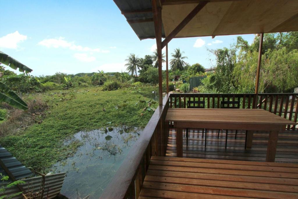 Tung's Tropika - With a Wooden Hut by a Lake photo 3
