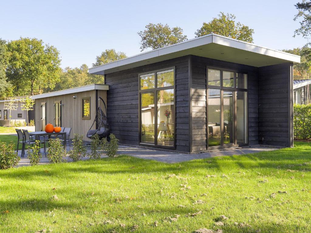 Modern wellness chalet with a smart TV, next to the forest photo 1