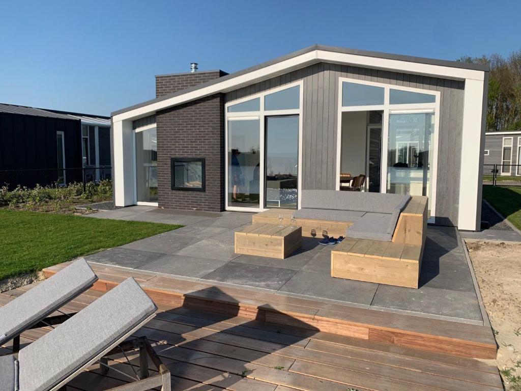 Modern chalet with jetty and terrace near the Oosterschelde photo 1