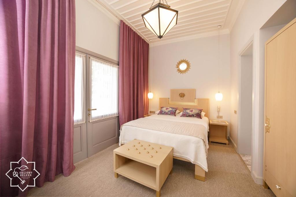 Delight Deluxe Hotel - Tap to explore photos