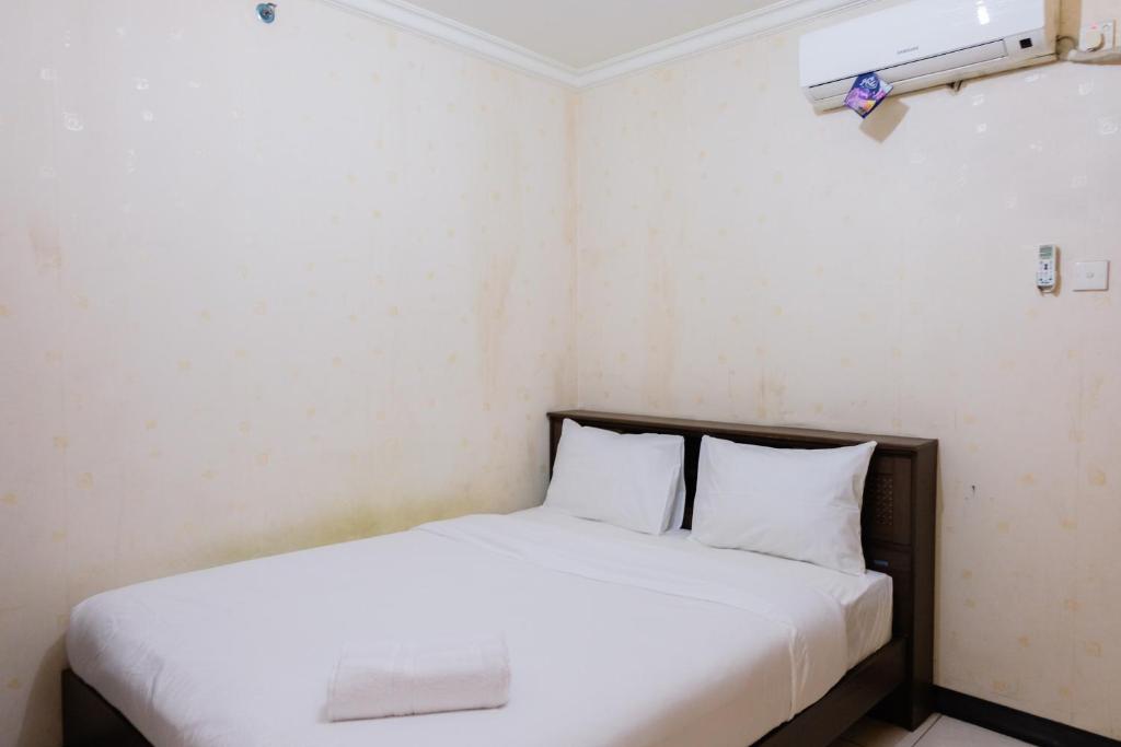 2BR Apartment at 18th Floor Great Western By Travelio