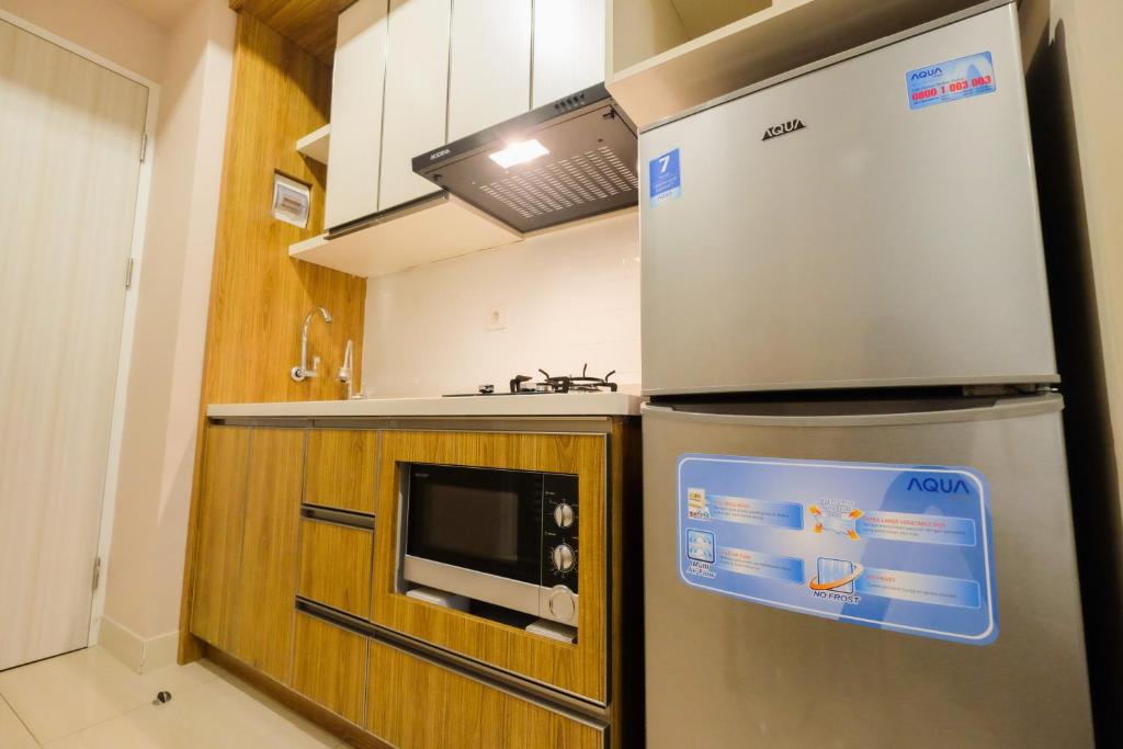 Best Furnished Studio Grand Kamala Lagoon Apartment By Travelio photo 3