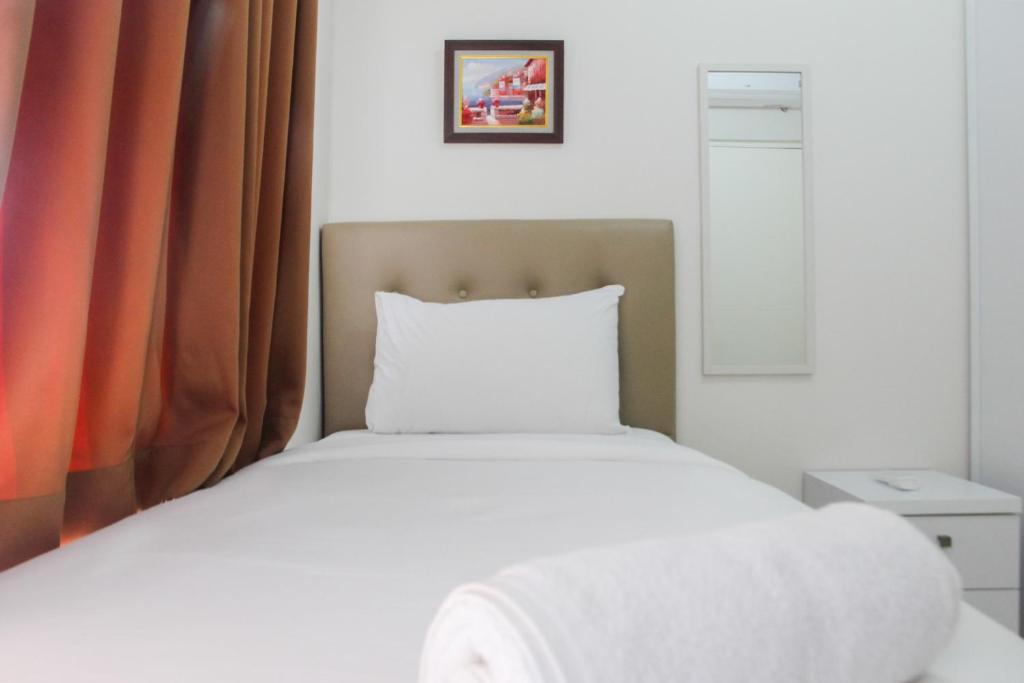 Exclusive 2BR Springlake Summarecon Bekasi Apartment By Travelio photo 1