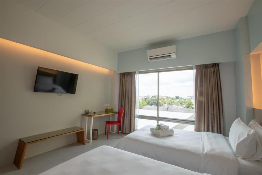 โรงแรมโกลว์ รัตนา เพลส Room Type - Deluxe Twin Room