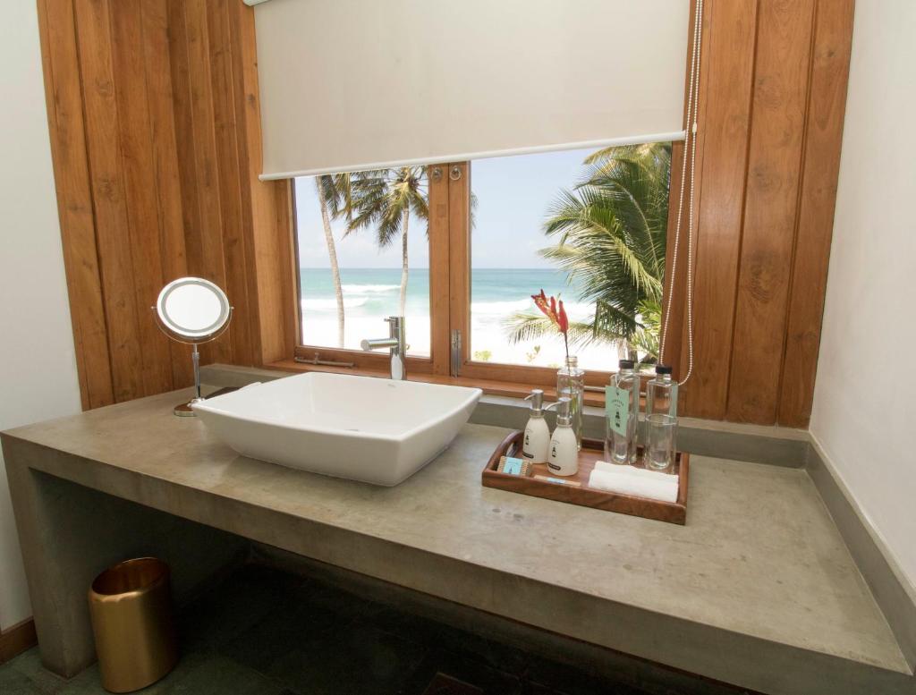Ubuntu Beach Villas by Reveal - Tap to explore photos