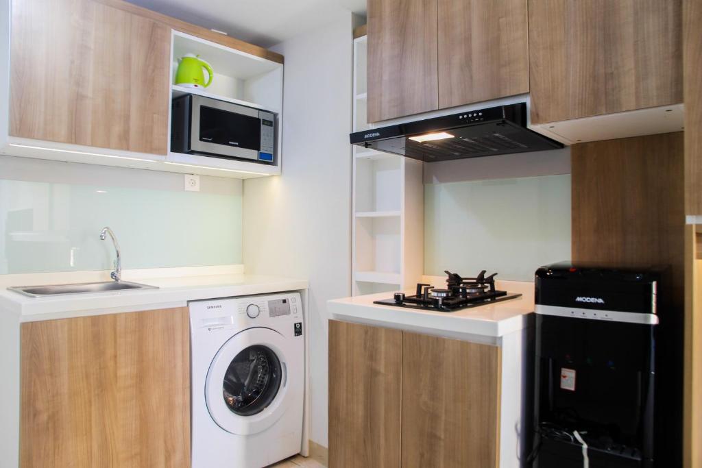 2BR with Sofa Bed at Springlake Summarecon Apartment By Travelio photo 3