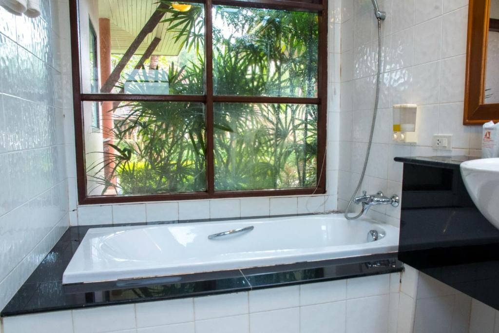 Lanta Casuarina Beach Resort - Tap to explore photos