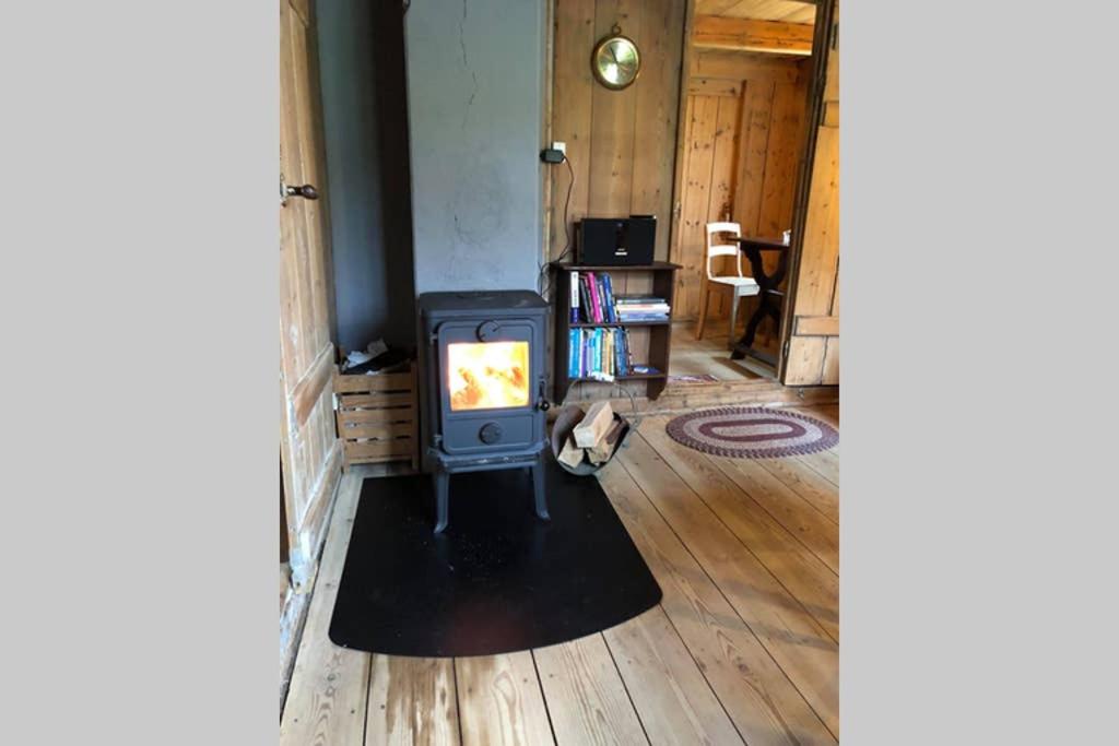 Turf house in Saksun with panoramic view photo 3