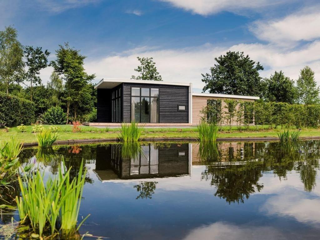 Modern bungalow with nice garden at forest edge photo 1