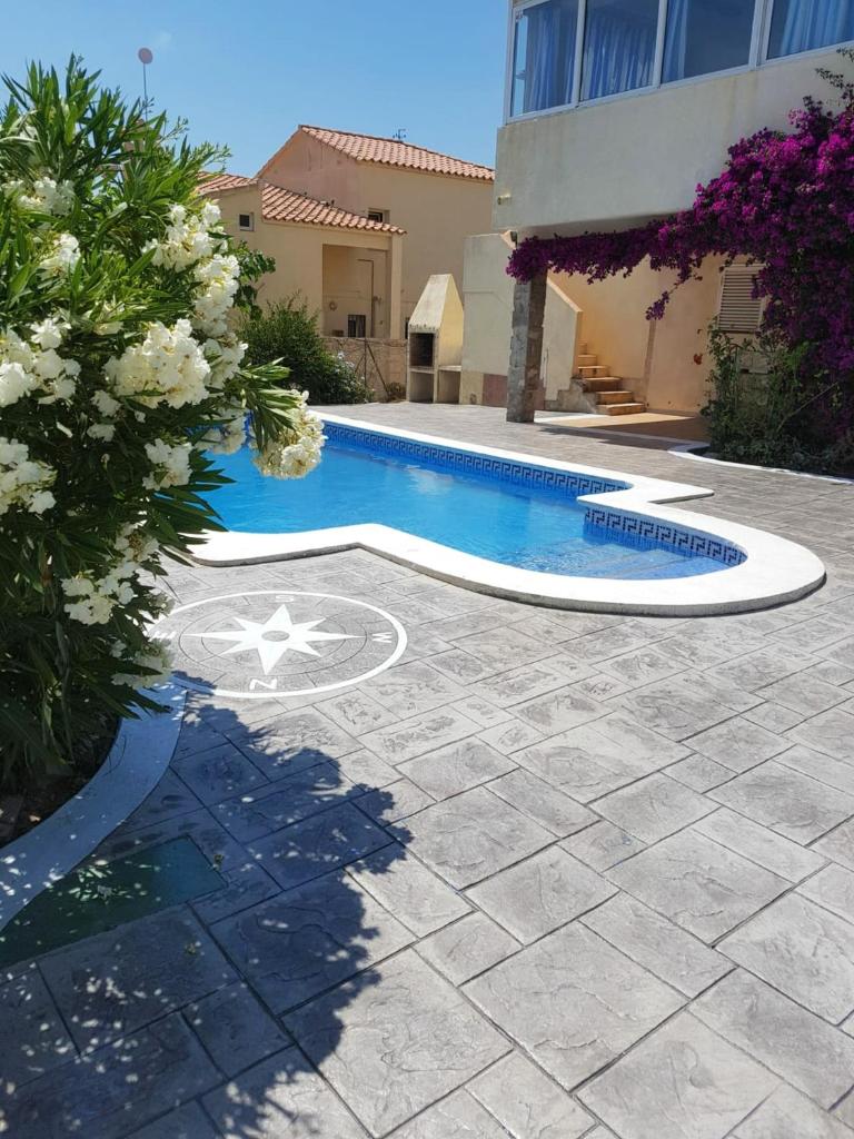 5 bedrooms villa at Calafat 200 m away from the beach with sea view private pool and furnished garden photo 1