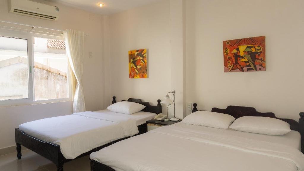 Двухместный (Двухместный номер Делюкс с 2 отдельными кроватями), Hue Nino Hotel