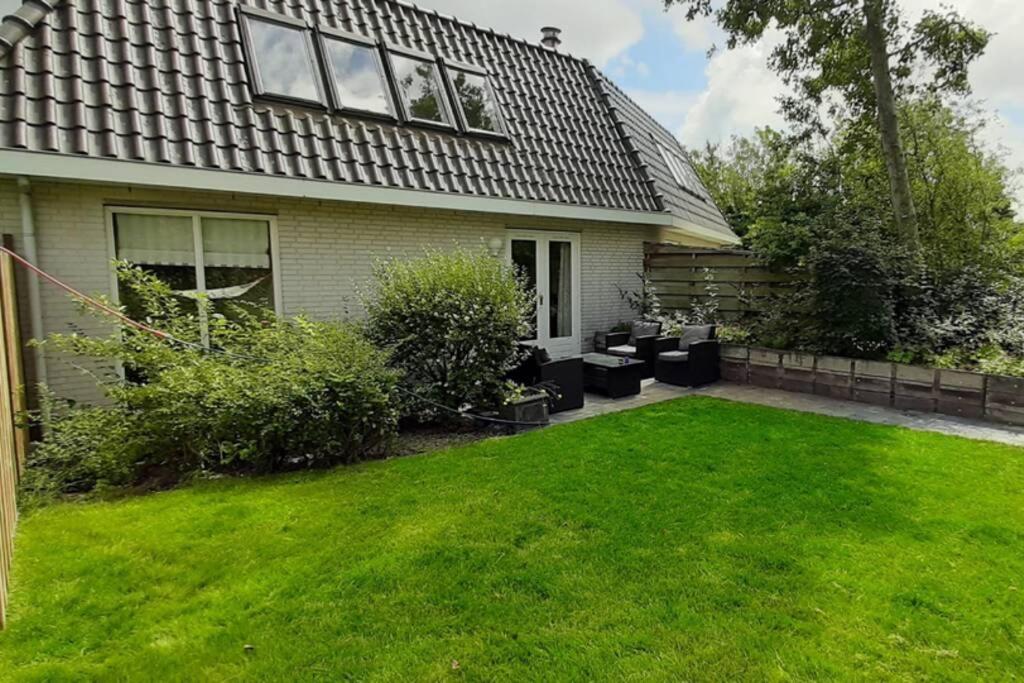 Holiday Home de witte raaf with garden and hottub photo 1