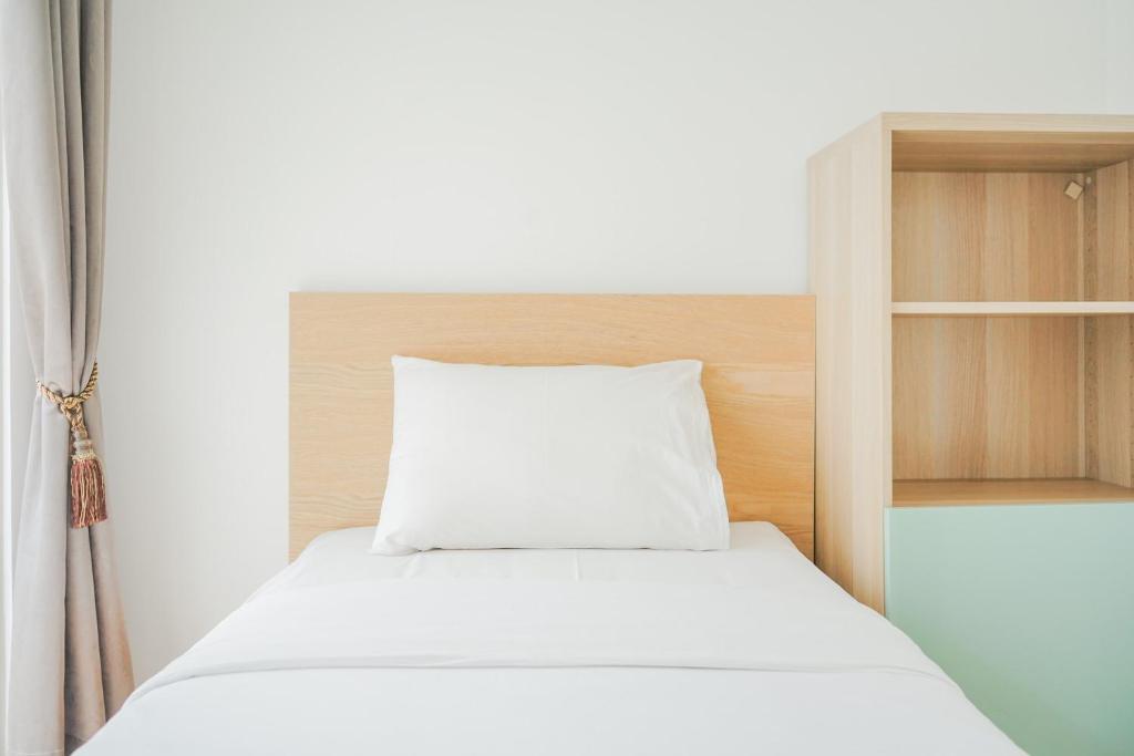 Spacious and Elegant 2BR M-Town Serpong Apartment By Travelio