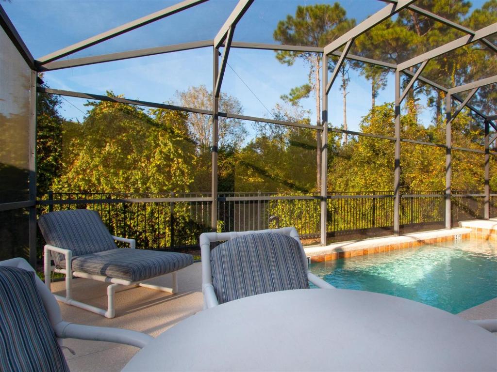 4 Bed and 3 Bath in Perfect Location With Pool by Florida Dream Home image