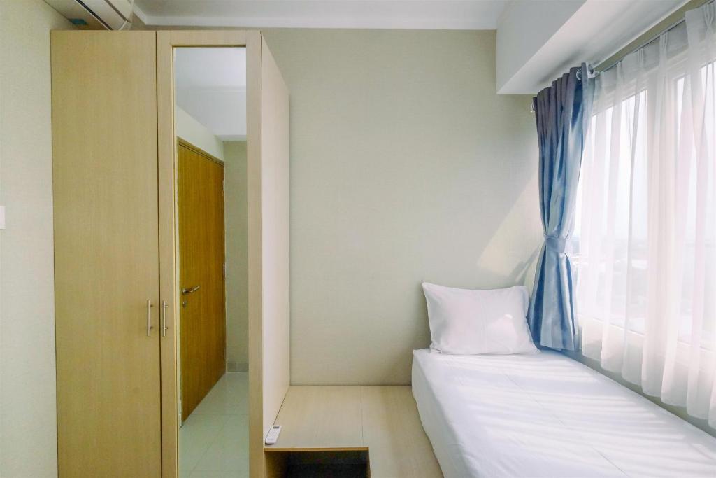 Comfortable and Spacious 2BR at Oasis Cikarang Apartment By Travelio photo 1