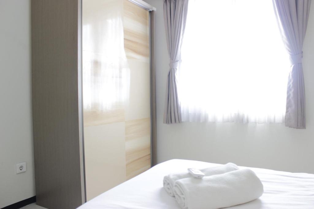 Spacious 2BR Apartment Gateway Pasteur near Exit Toll 23 By Travelio - Tap to explore photos