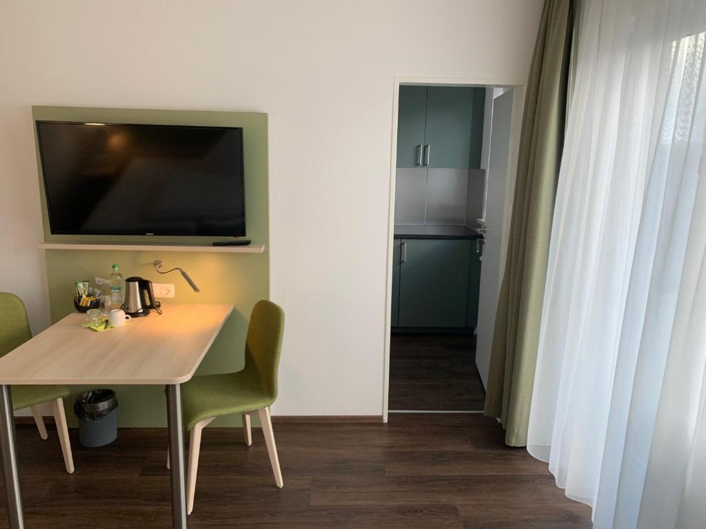 Marias Inn Living - Hotel & Apartments Garching bei München - Tap to explore photos