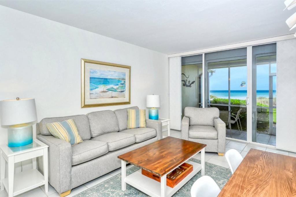 LaPlaya 101A Step out to the beach from your screened lanai Light and bright end unit photo 1