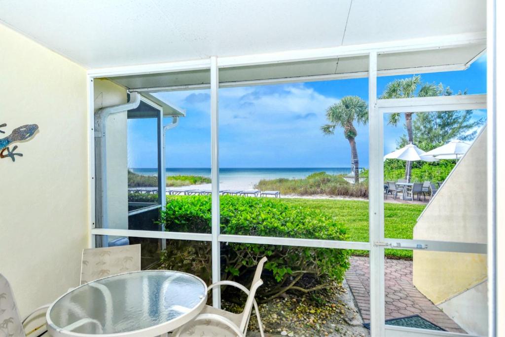 LaPlaya 101A Step out to the beach from your screened lanai Light and bright end unit photo 2