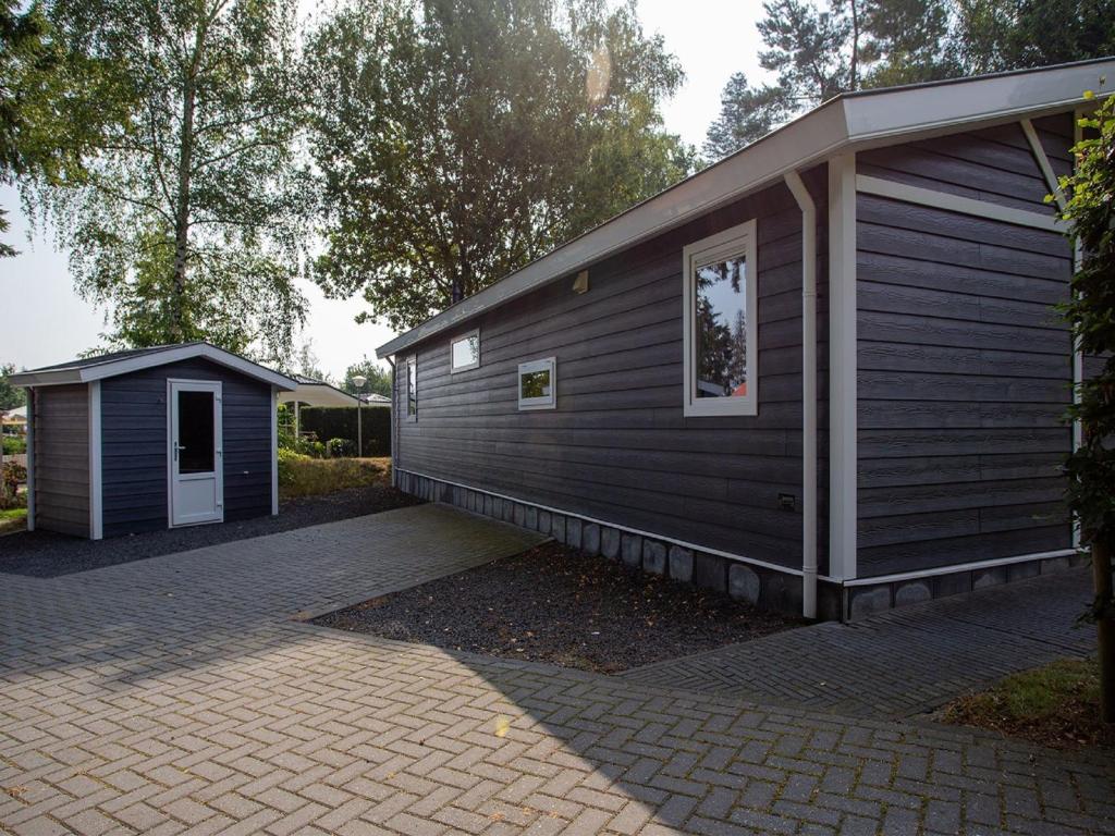 Modern chalet with covered terrace in nature photo 4
