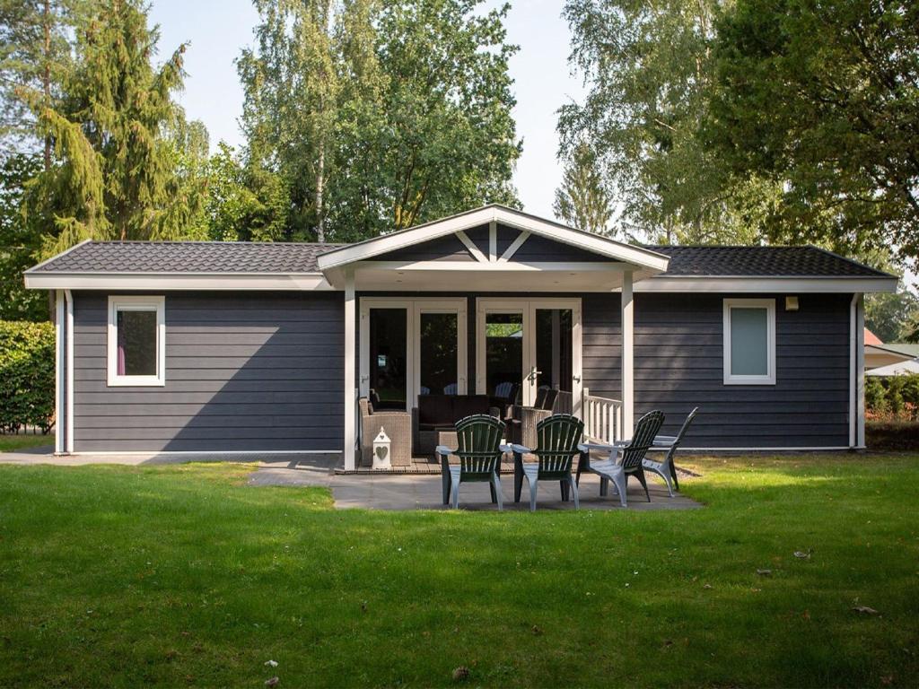 Modern chalet with covered terrace in nature photo 3
