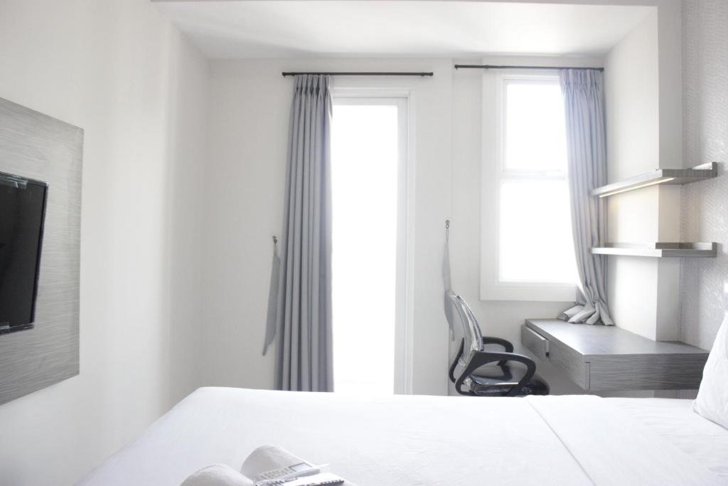 Simply 2BR without Living Room Apartment at Parahyangan Residence By Travelio, Bandung