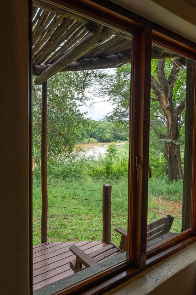 Bushriver Lodge - Tap to explore photos