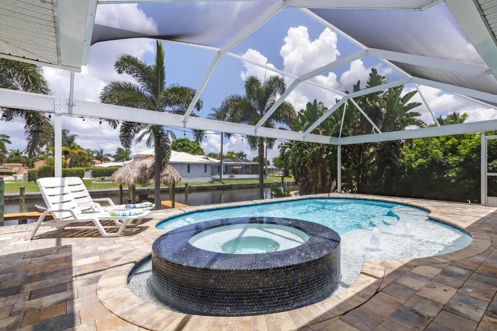 Half mile to the beach! Heated Pool & Spa, with Tiki on boat dock! - Villa Changes in Attitude image