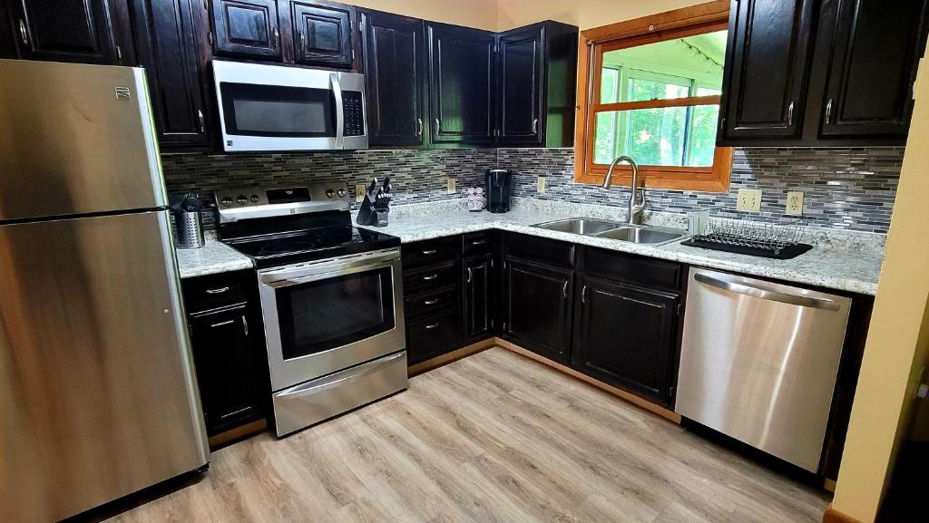 The Pocono's Retreat with a Gameroom, Firepit, and Lake photo 3