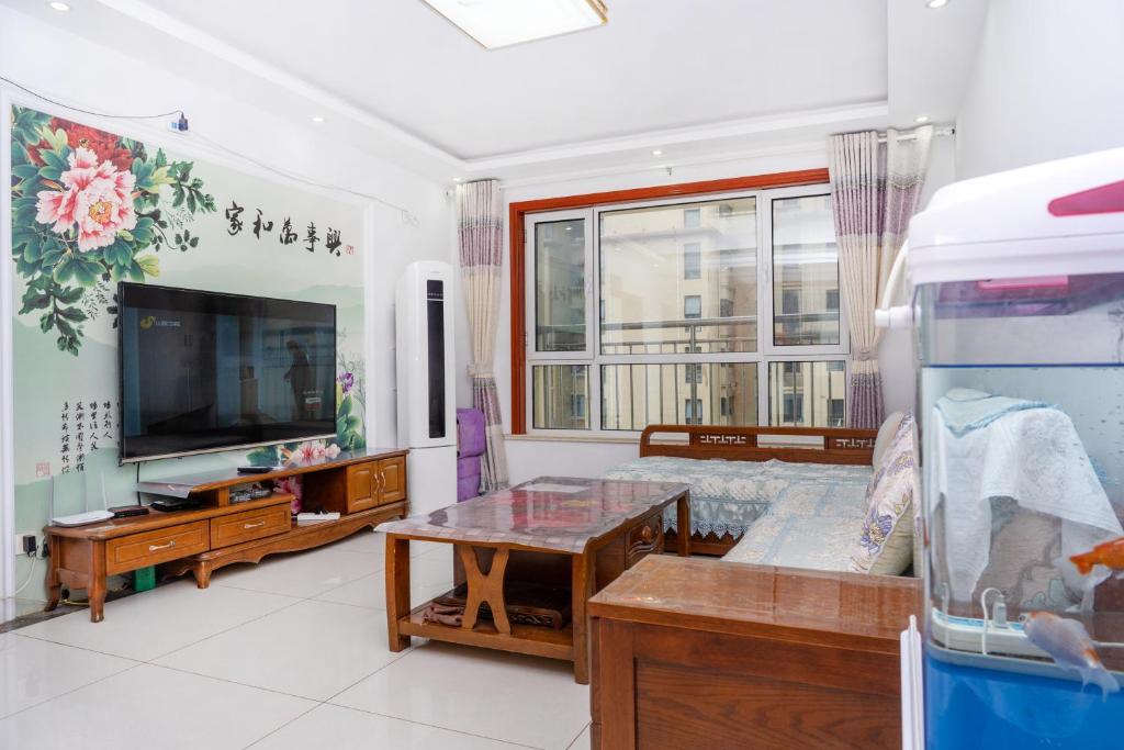 青岛金沙滩全家幸福三居室海景公寓Blessed Family Apartment photo 1