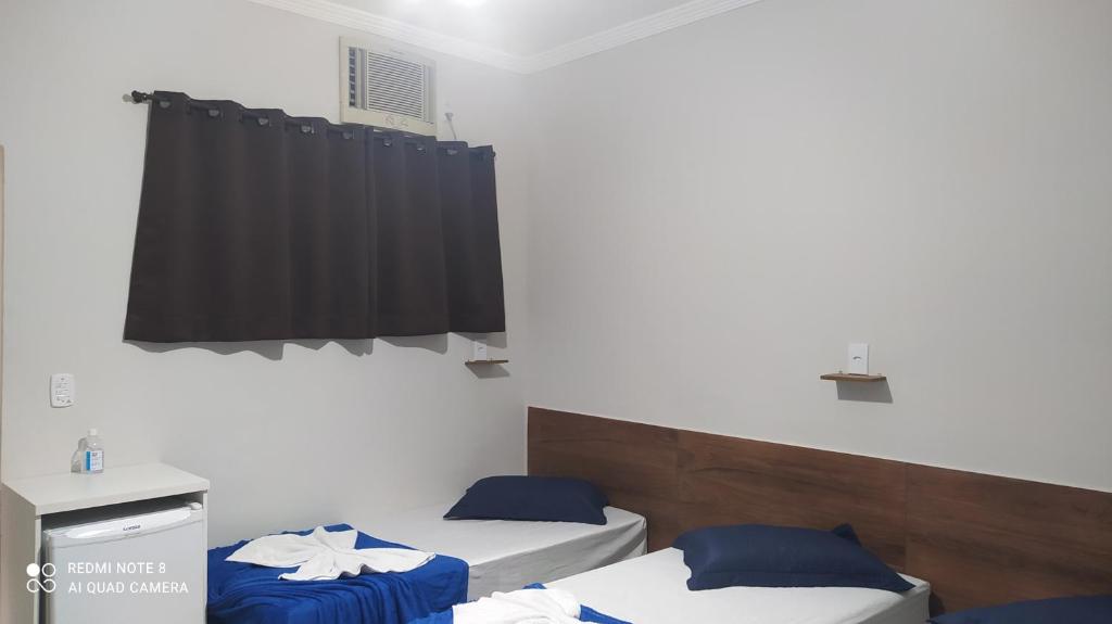 Quarto com frigobar,ar e garagem gratuita photo 4